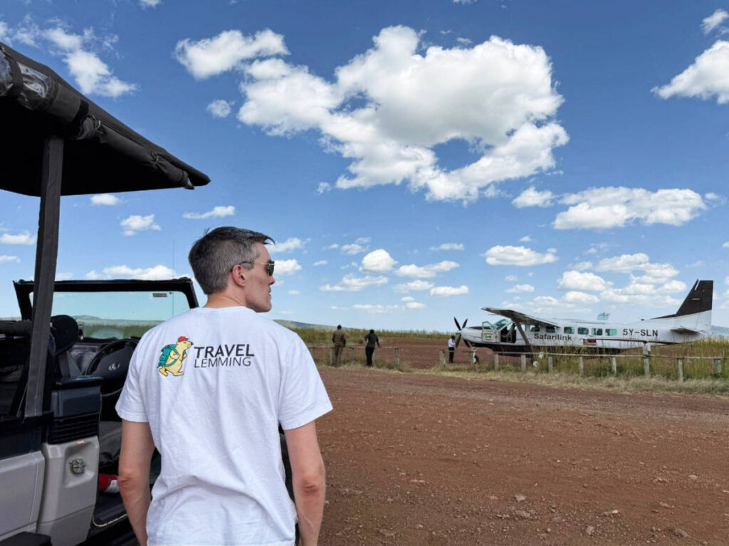 The author Nate Hake posing for a photo at the airstrip in Airstrip in Masai Mara
