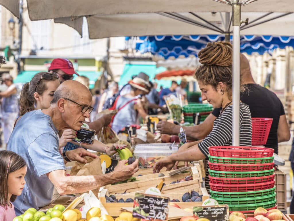 People buying supplies at the Aix-en-Provence Market