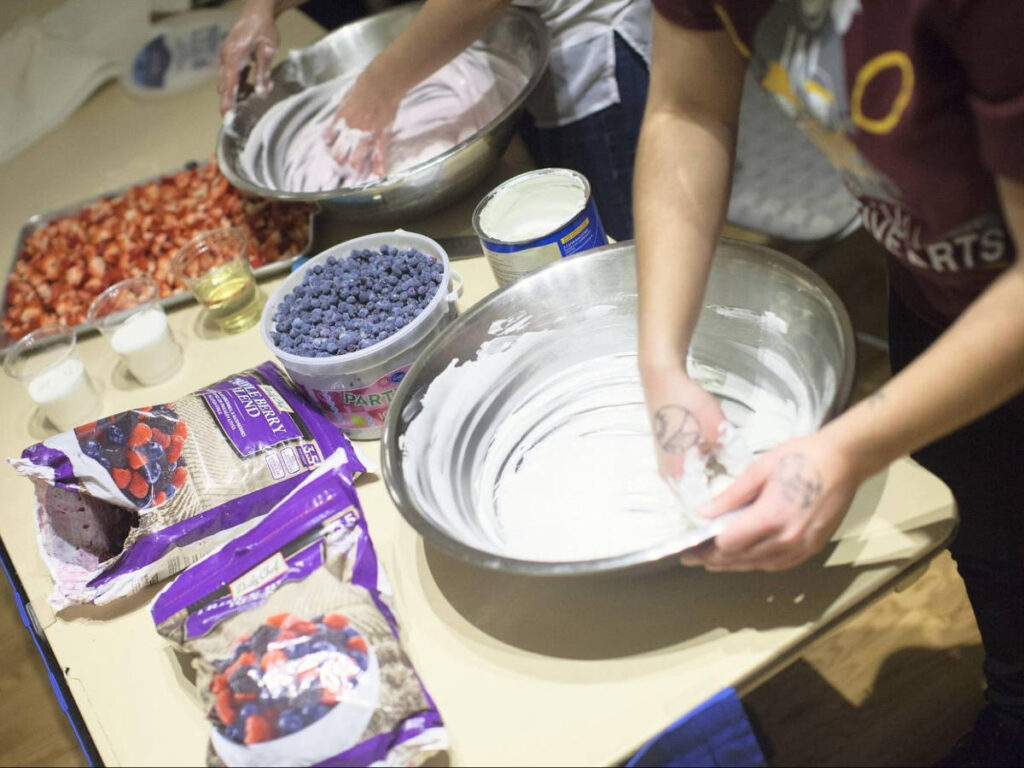 People making akutaq, an Alaskan ice cream