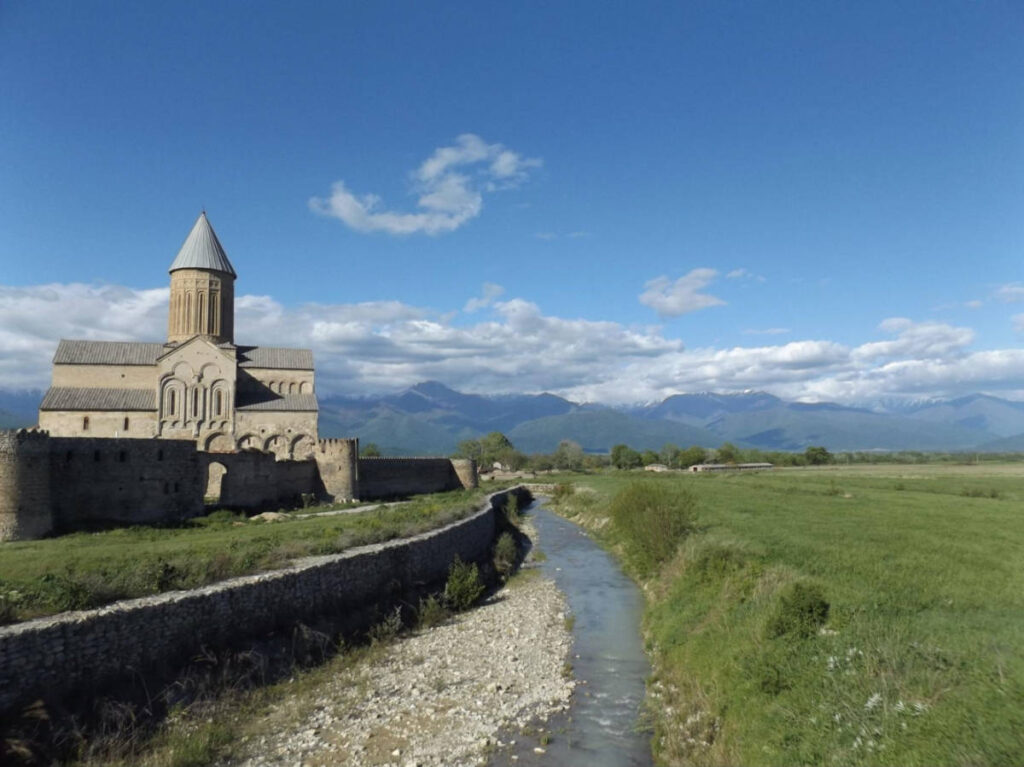 View of the Alaverdi Cathedral and a small stream and greenery around