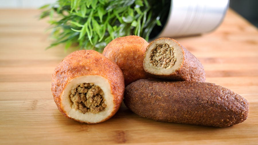 Alcapurrias stuffed with meat on top of a table