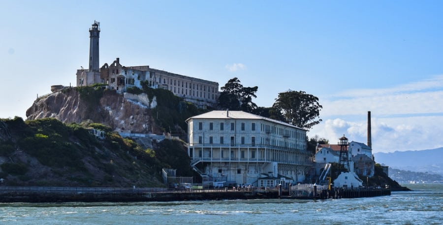 A close up view of the buildings on Alcatraz Island across the ocean