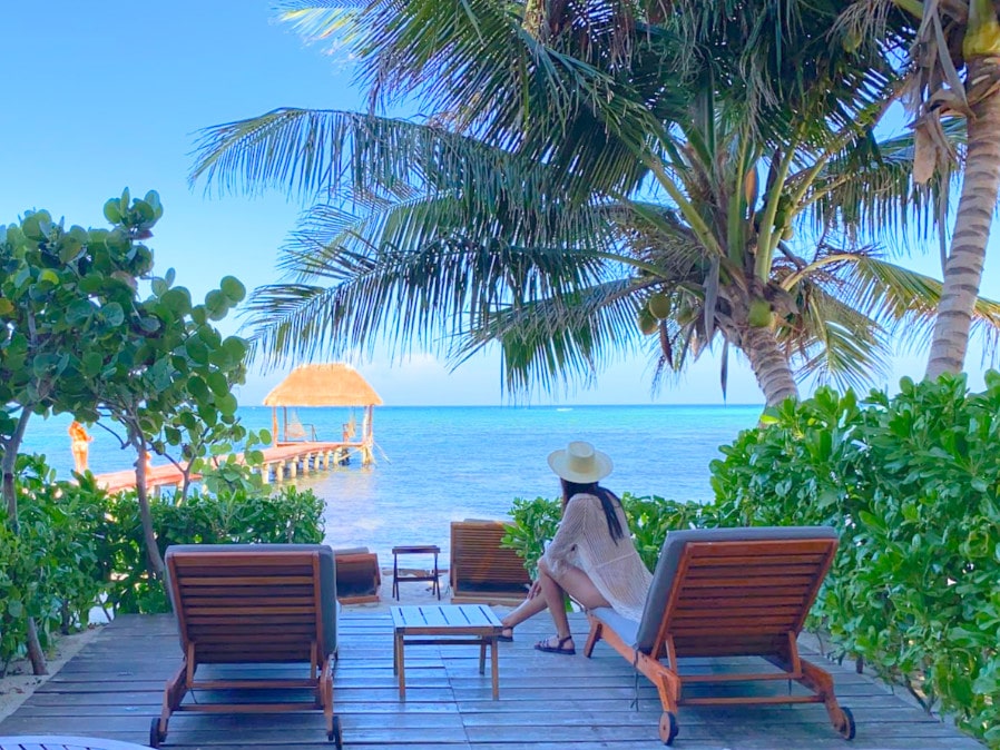 Clara sitting on a chair admiring the view of the ocean