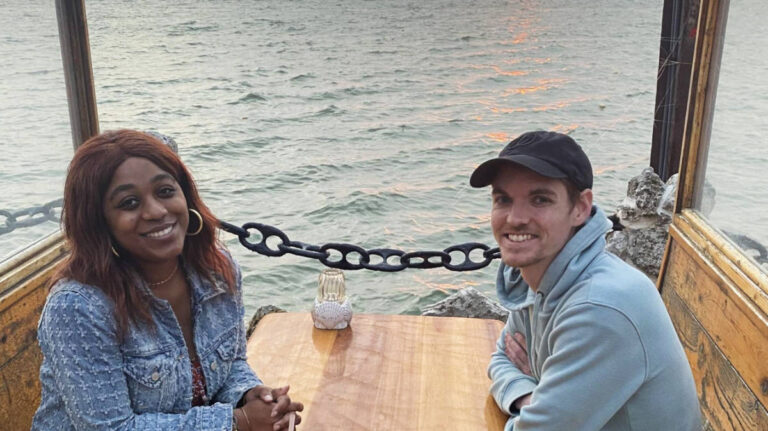Author Alexandria Taylor and Dylan enjoying a bayside dinner in Ocean City at sunset