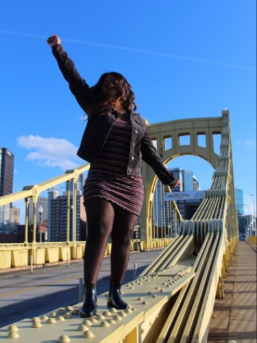 Alexandria Taylor posing for a photo on a bridge in Pittsburgh, Pennsylvania