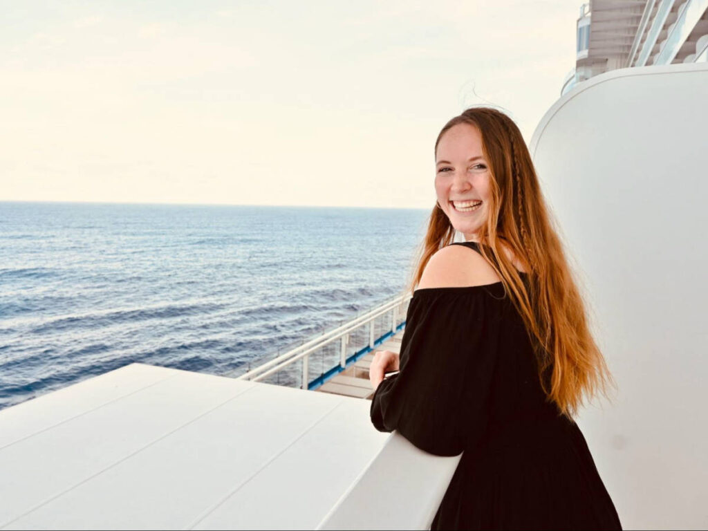 The author Allie Hubers, enjoying the overlooking view of the ocean in the Caribbean Cruise