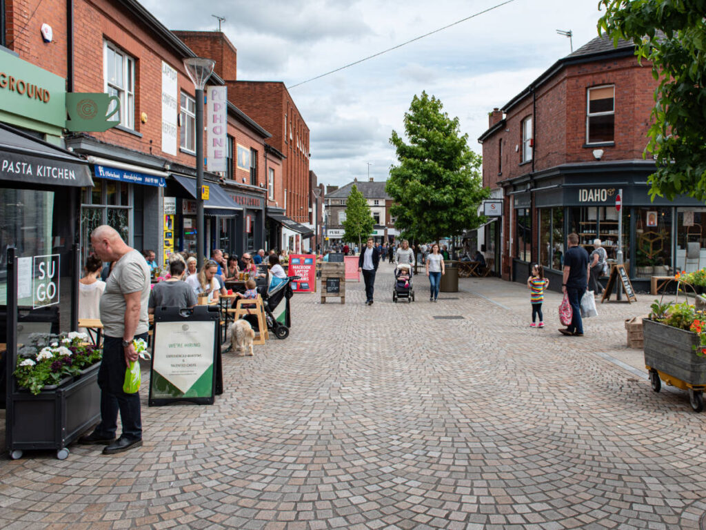 People buying at the shops and restaurants in Altrincham town centre