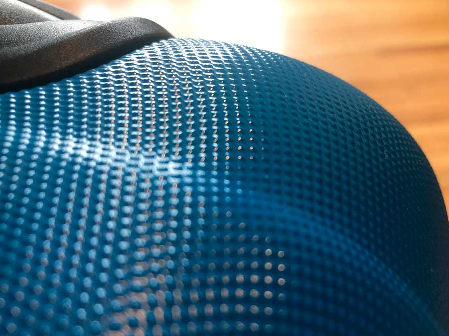 Close up view of the hard shell exterior of Amazon Basics Luggage