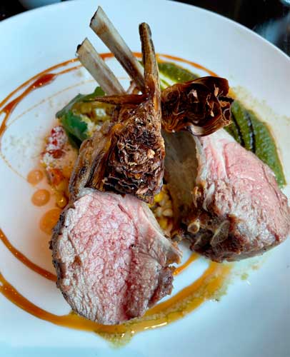 A rare lamb on a plate in American Bounty Restaurant