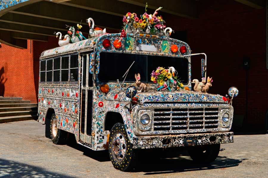 A decorated school bus outside the American Visionary Art Museum
