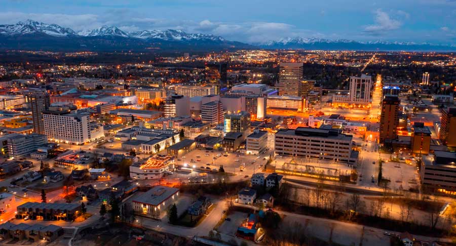 Aerial view of buildings in Anchorage with lights at night