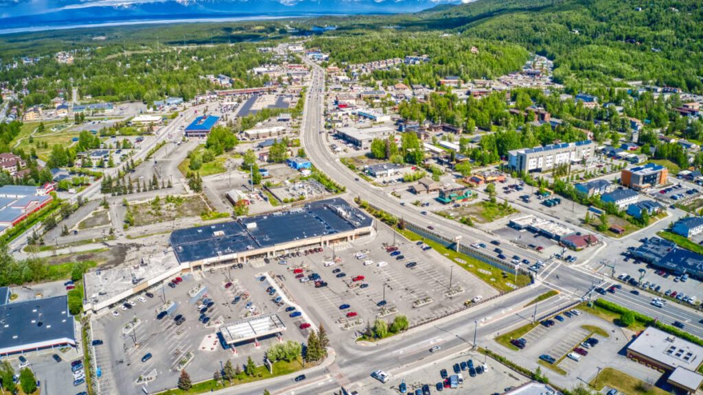 Aerial view of the Eagle River suburb and the lush mountains in the background