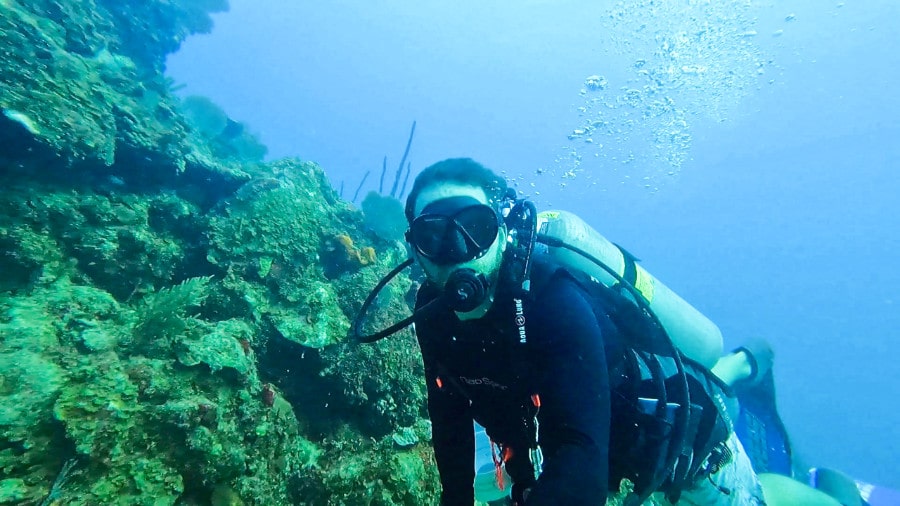 The author Andrew Bloem scuba diving on the shallow coral reef near St. Thomas