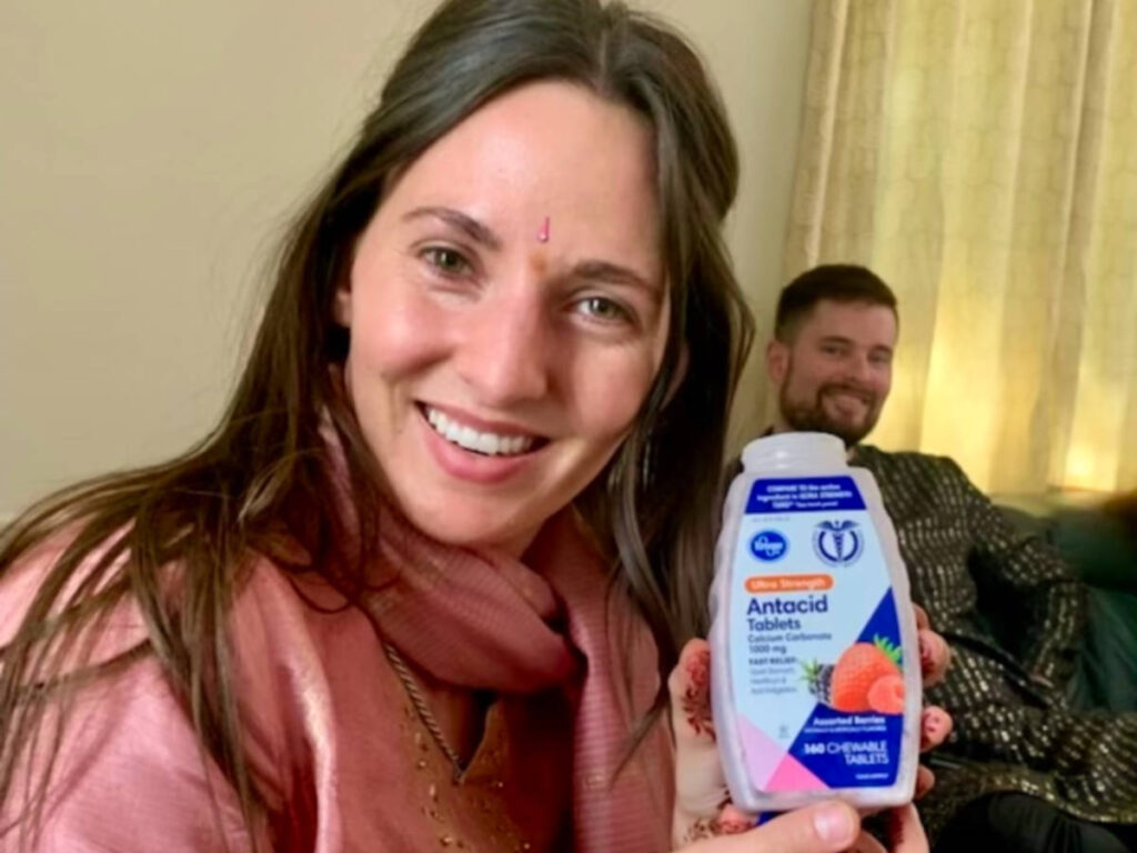 A lady showing her Antacid tablets