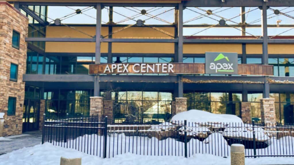 View of the façade of the Apex Center from the street in winter