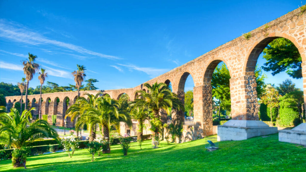 View of the famous aqueducts surrounded by greenery in Plasencia
