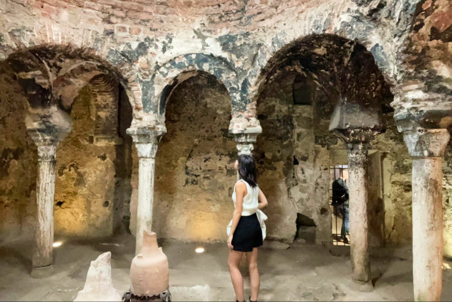 The author Lea Rose Allbaugh inside the ancient caldarium