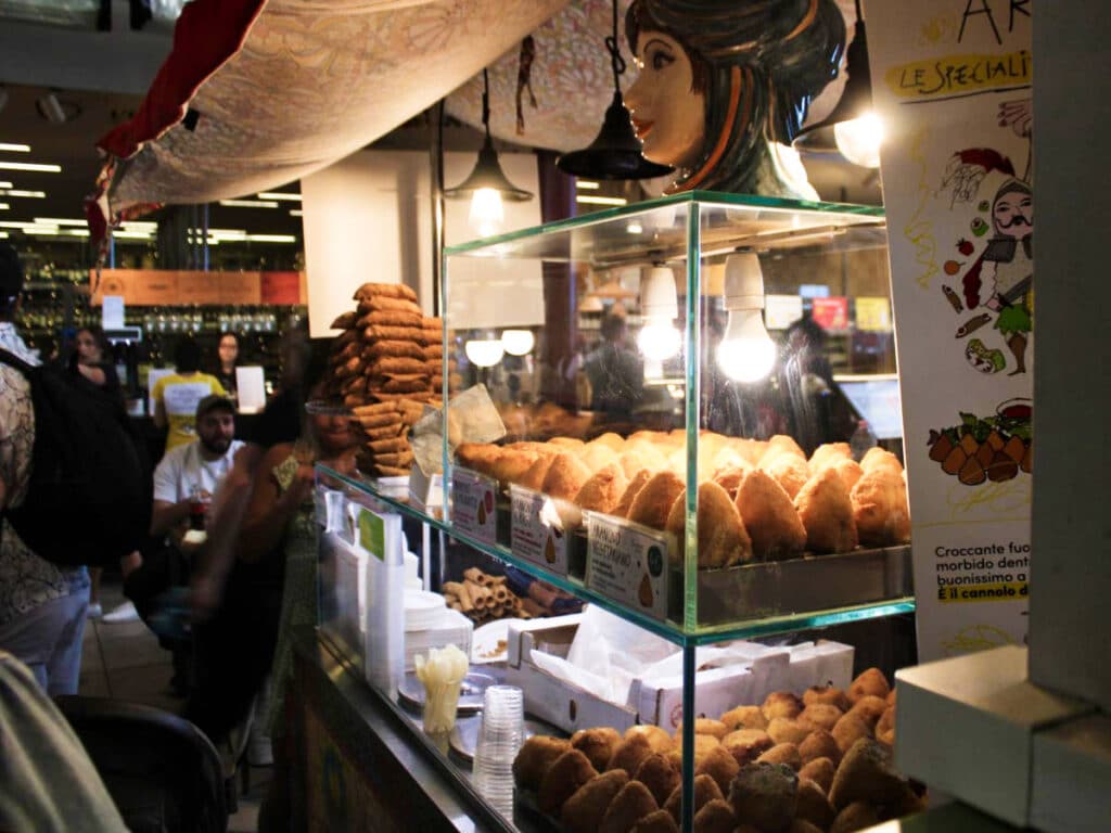 View of a stall with displayed Arancino at the Florence Central Market