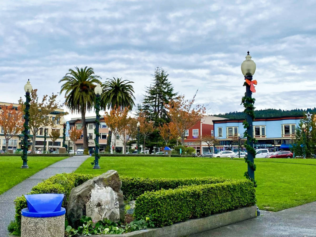 View of the shops around the lush park at the main square in Arcata