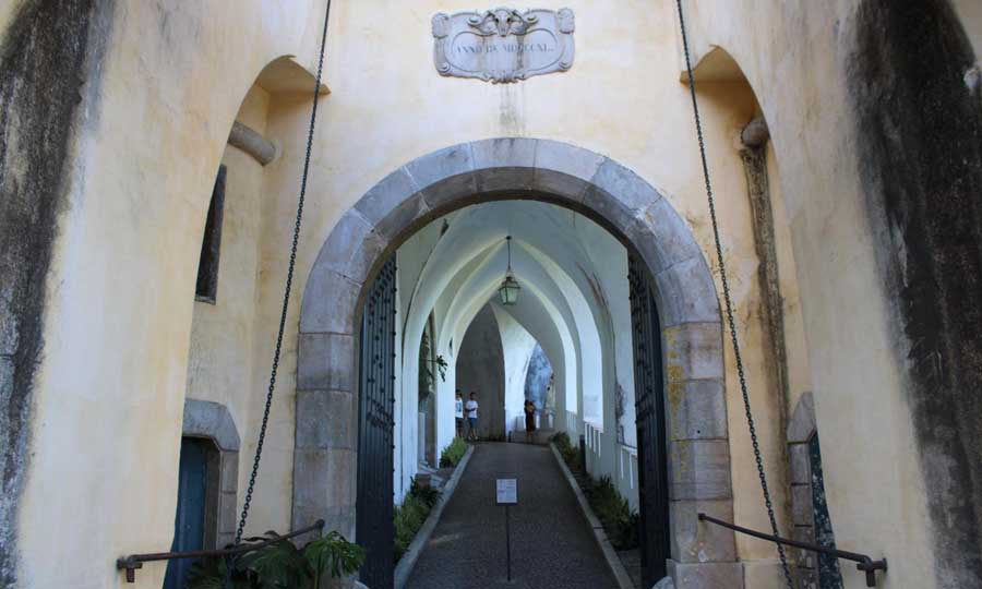 An arch pathway on a building in Portugal