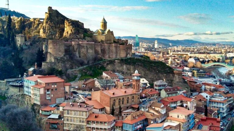 Overlooking view of the colorful houses, medieval churches, and modern hotels in Old Town in Tbilisi