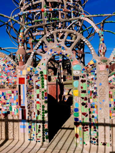 Archway with with colorful mosaic tiles at Watts Towers