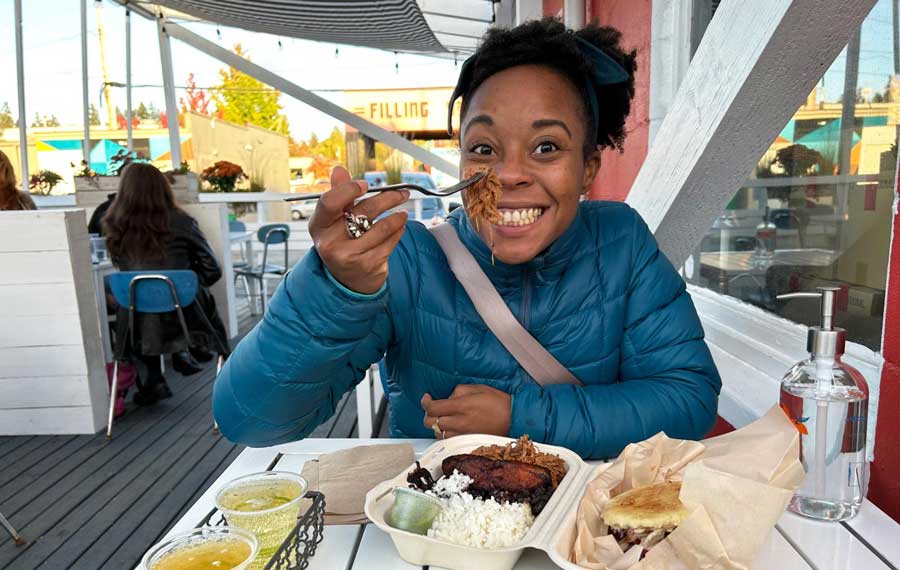 Author Chelsea enjoying her foods from Arepa Latin Street Food