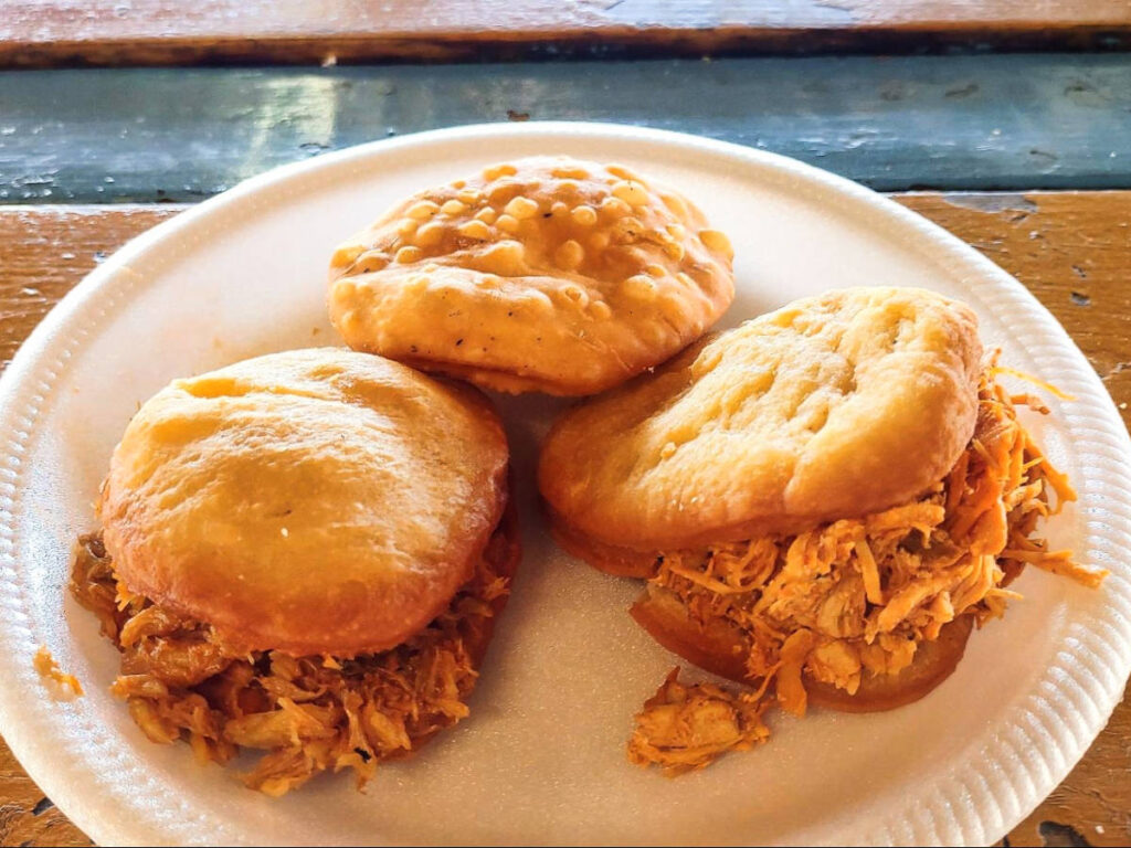 A plate of three Arepas stuffed with chicken