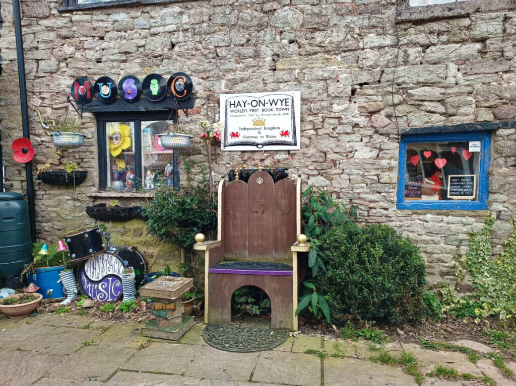 View of the art and huge chair display along the street at Hay-on-Wye