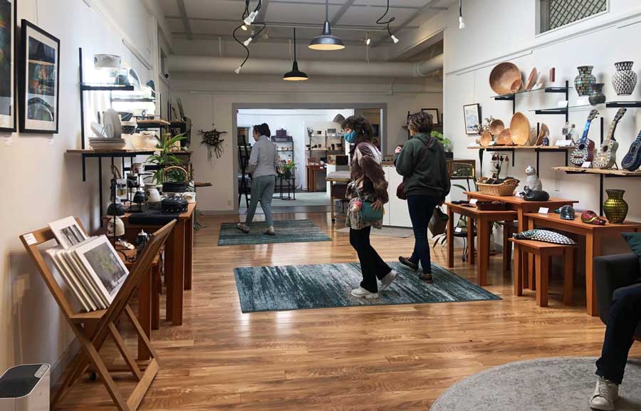 People wandering inside an Art Gallery in Vashon Island