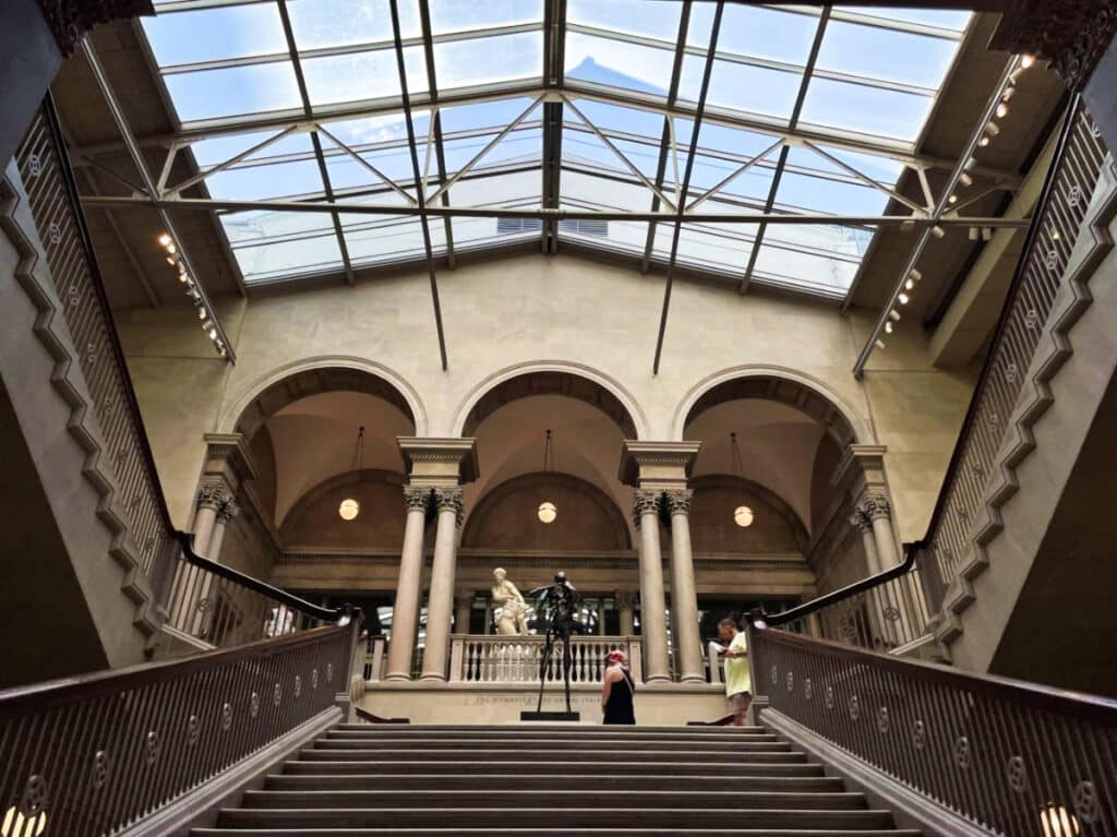 View of the interior of Art Institute with the grand staircase and see through ceiling