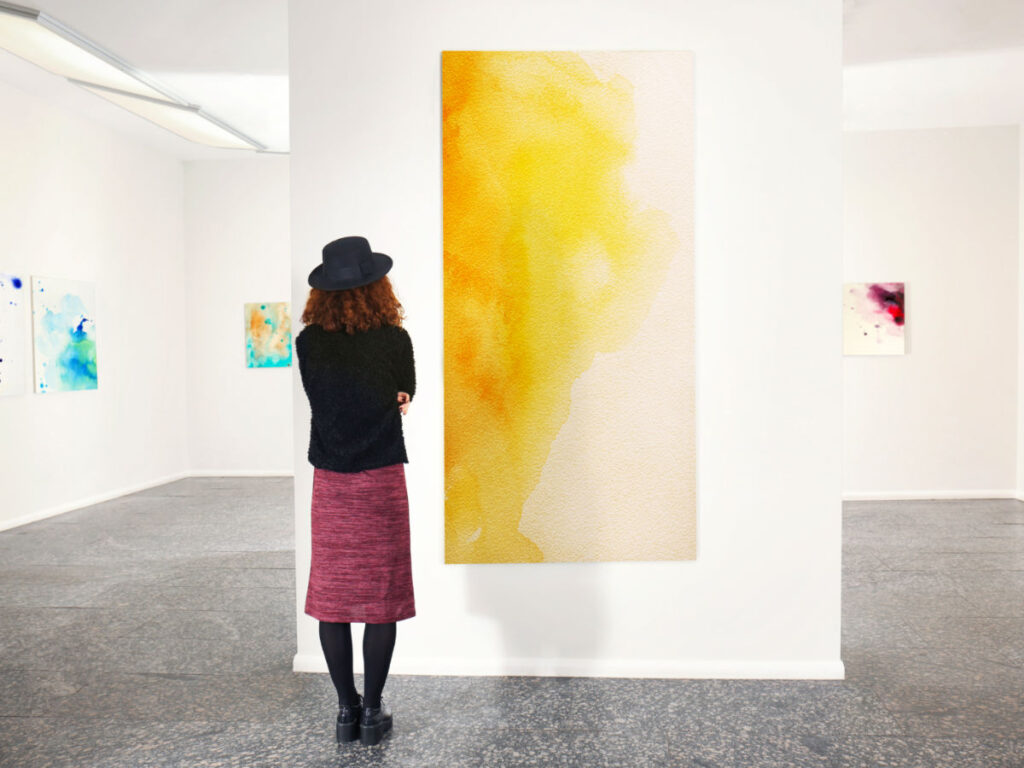 A woman looking at art pieces at EXPO Chicago