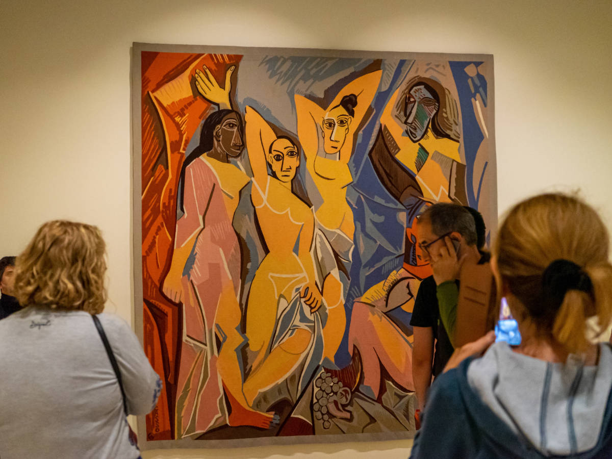 People admiring the “Les Demoiselles d'Avignon” by Picasso at the Picasso Museum Malaga