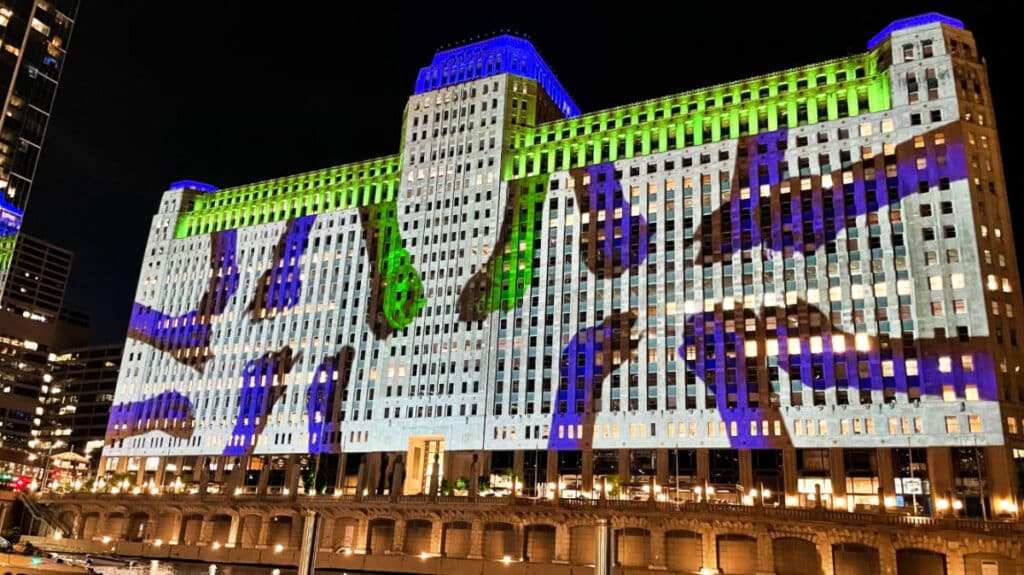 Digital art on the exterior of theMART illuminated at night