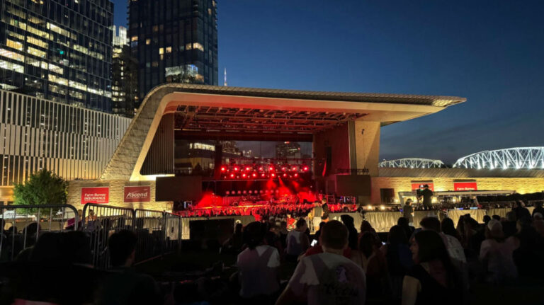 View of people watching an outdoor concert at night at Ascend Amphitheater in Nashville