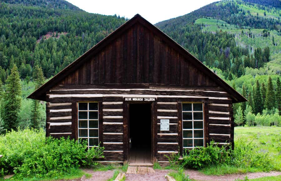The historic building of Blue Mirror Saloon with a scenic background