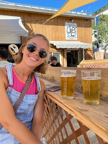 Ashleigh Bandimere trying out the beer in June Lake Brewing