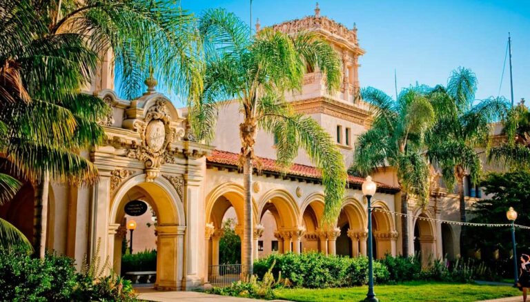 Building surrounded by palm trees at Balboa Park