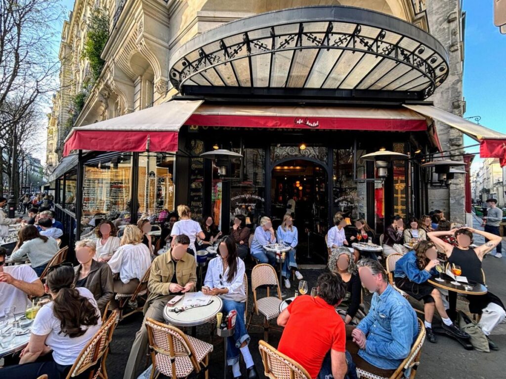 People dining at Café Charlot’s street patio