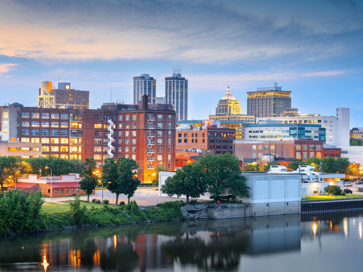View of Downtown Peoria's skyline, featuring modern buildings alongside a lake