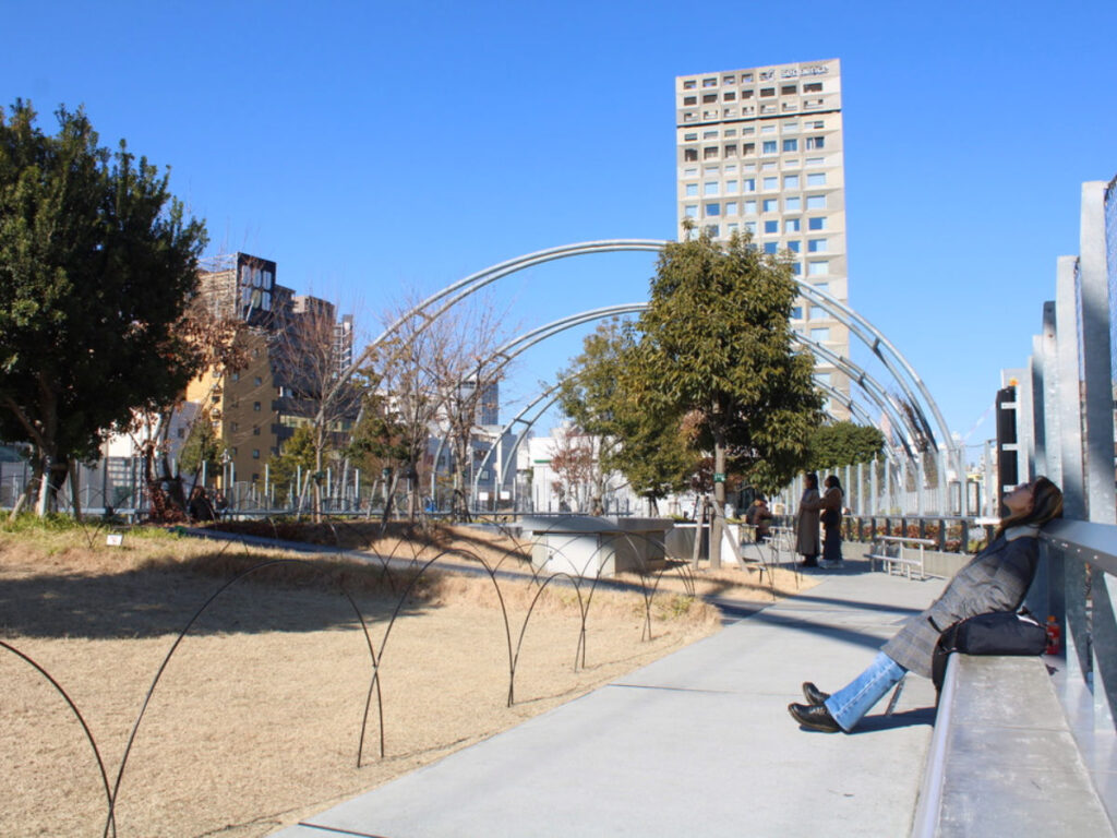 A woman resting at Miyashita Park