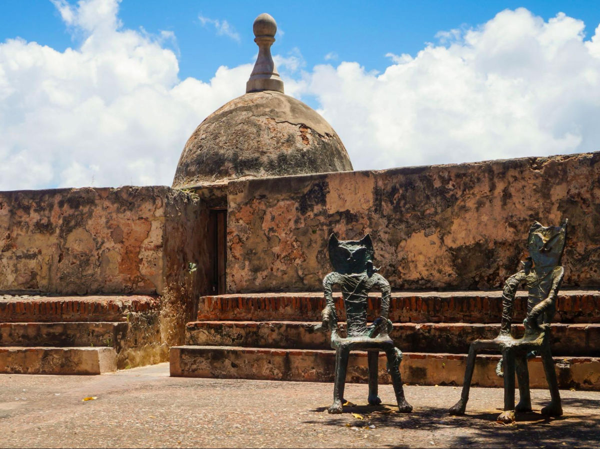 Two cat chairs on a stone wall at Old San Juan