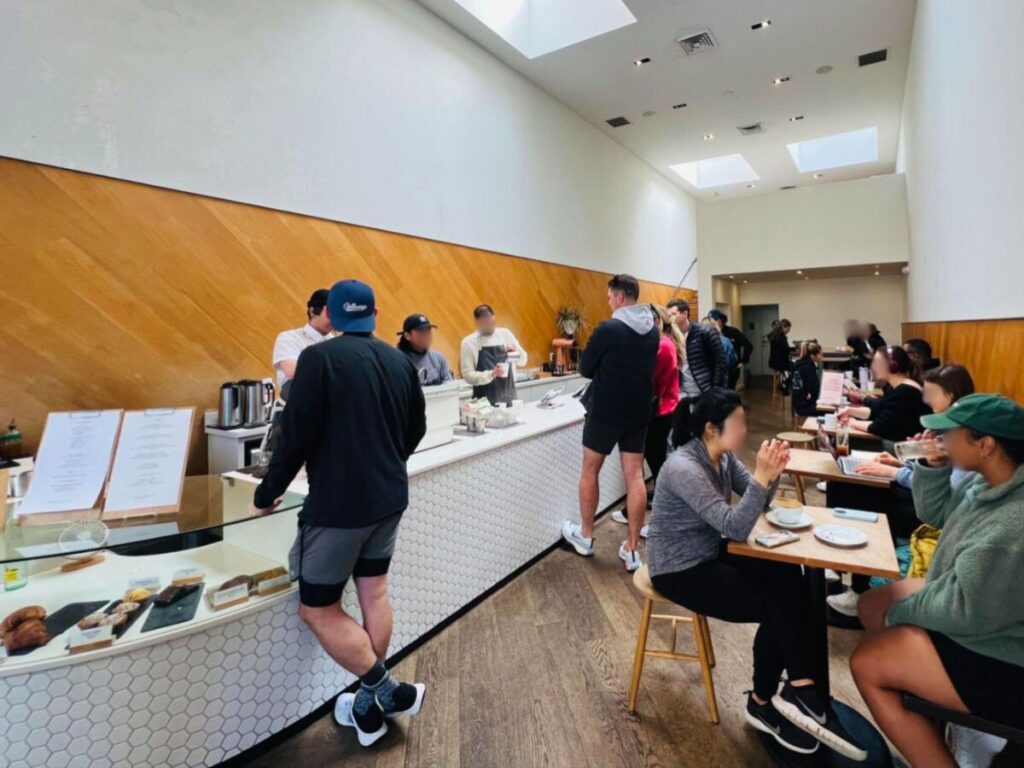 People ordering and dining at Saint Frank Coffee