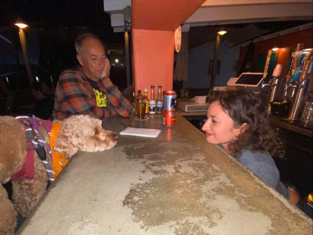 Author's dog and the bartender at Señor Grubby’s Carlsbad staring at each other
