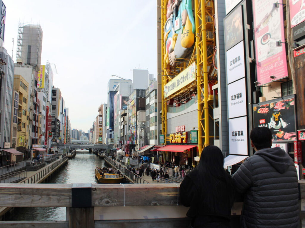 Couple enjoying the views at the Dotonbori Canal