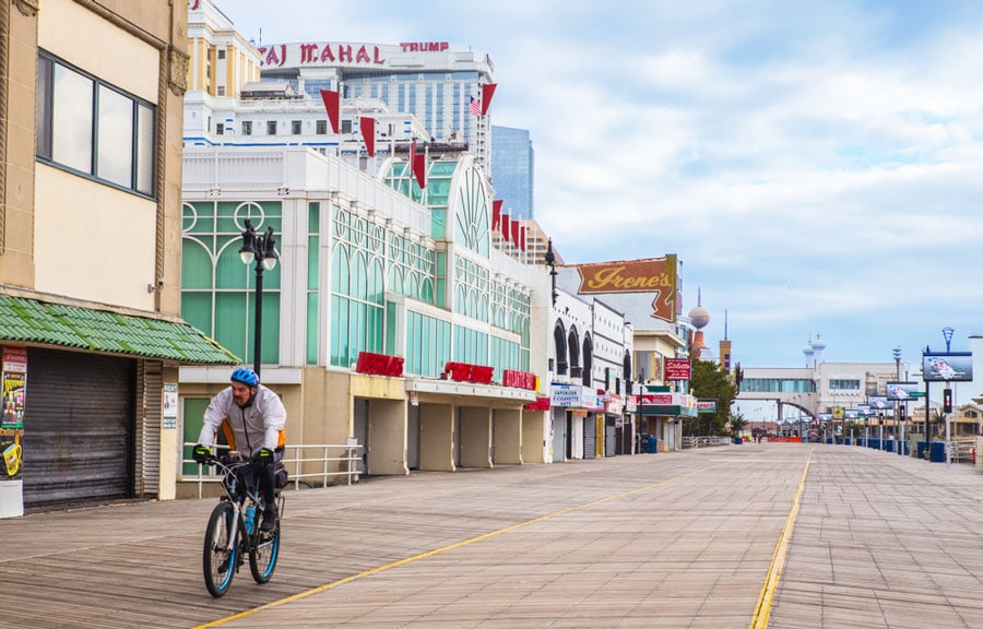 View of a man cycling along the Boardwalk in Atlantic City