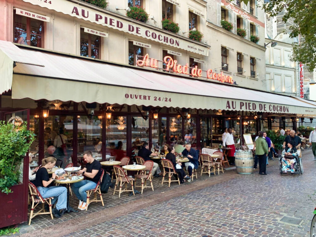 View of the people dining at the terrace of Au Pied de Cochon