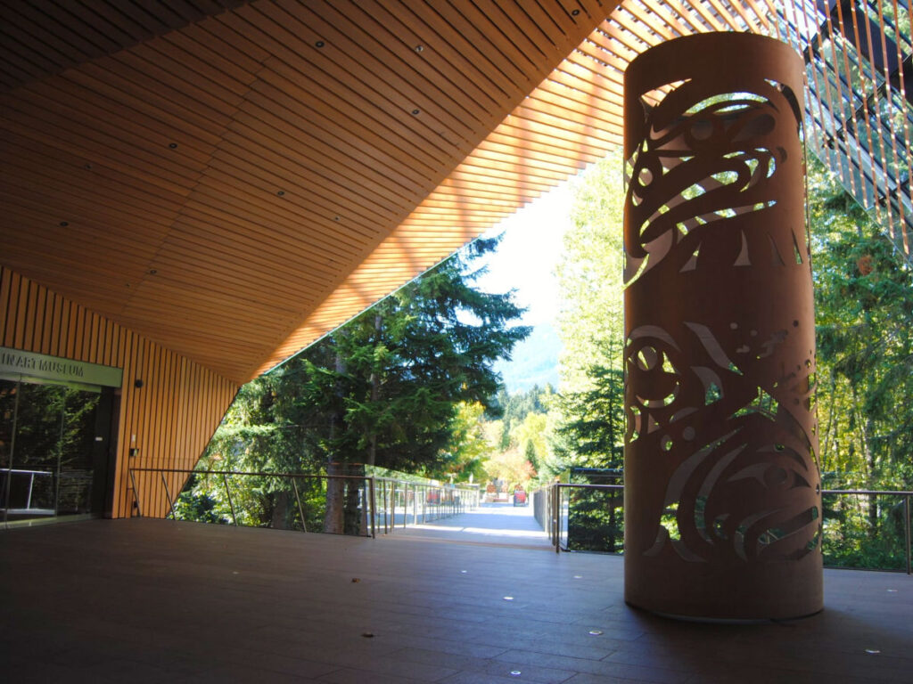 An intricately designed tall column at the entrance of Audain Art Museum