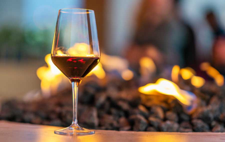 A glass of wine of a table