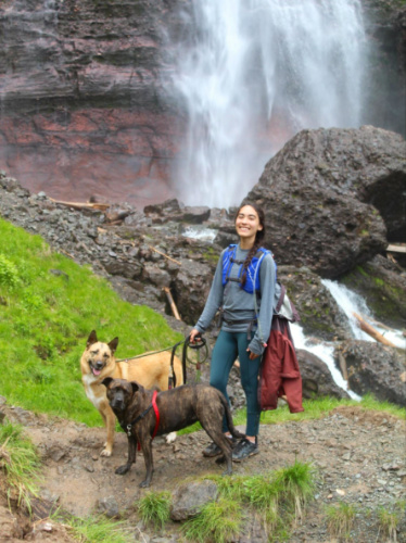 Author Abigail and her dogs at the base of Bridal Veil Falls